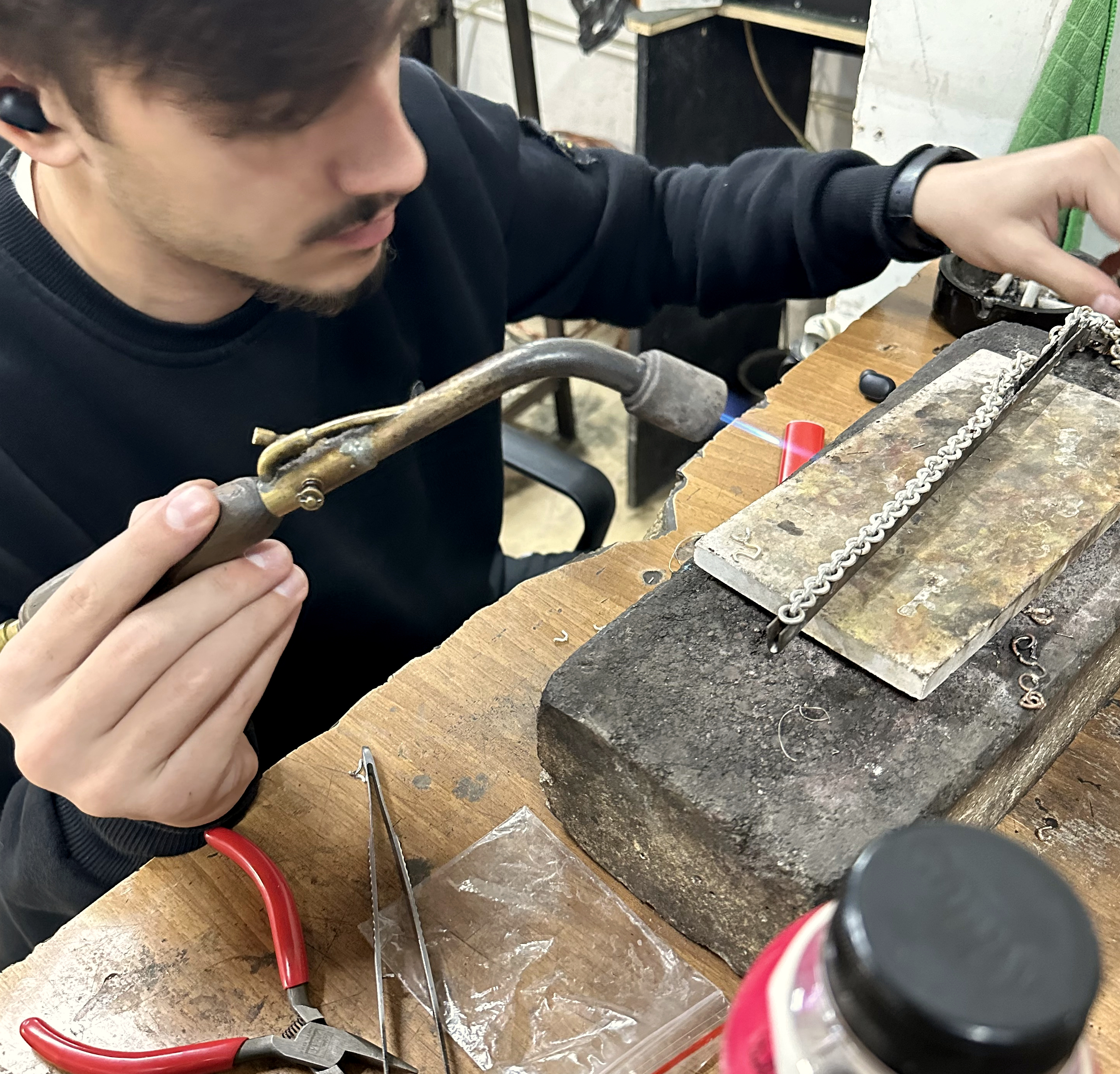 Jeweler working at a real jewelry bench